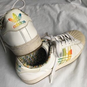 white adidas with rainbow stripes